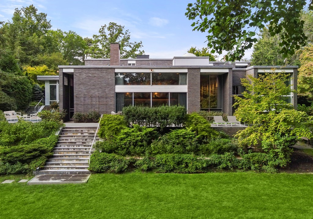 64 Highland Street Cambridge, MA 02138 - Photo 2 of 41 a front view of a house with a garden