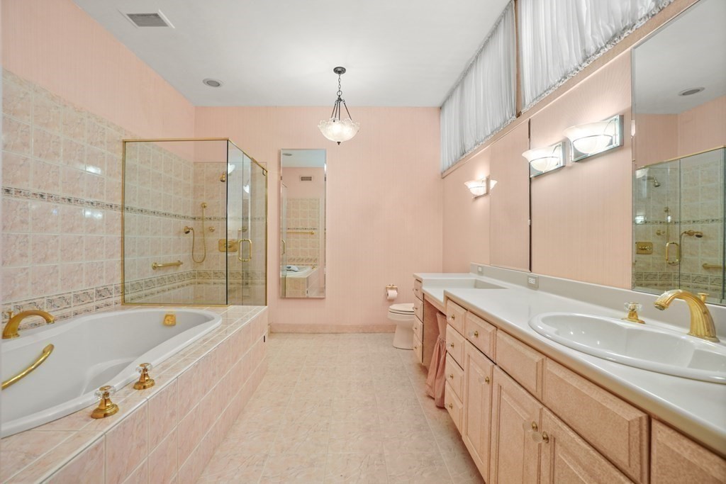 64 Highland Street Cambridge, MA 02138 - Photo 23 of 41 a spacious bathroom with a granite countertop tub sink shower and mirror