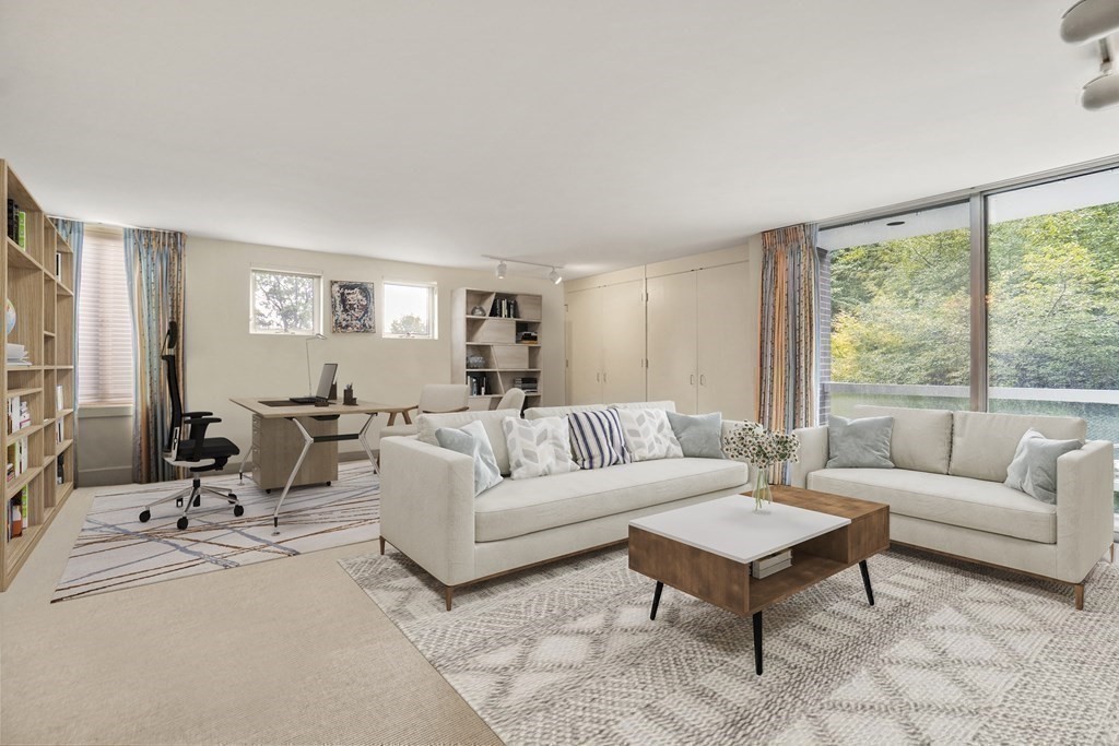 64 Highland Street Cambridge, MA 02138 - Photo 24 of 41 a living room with furniture and a large window