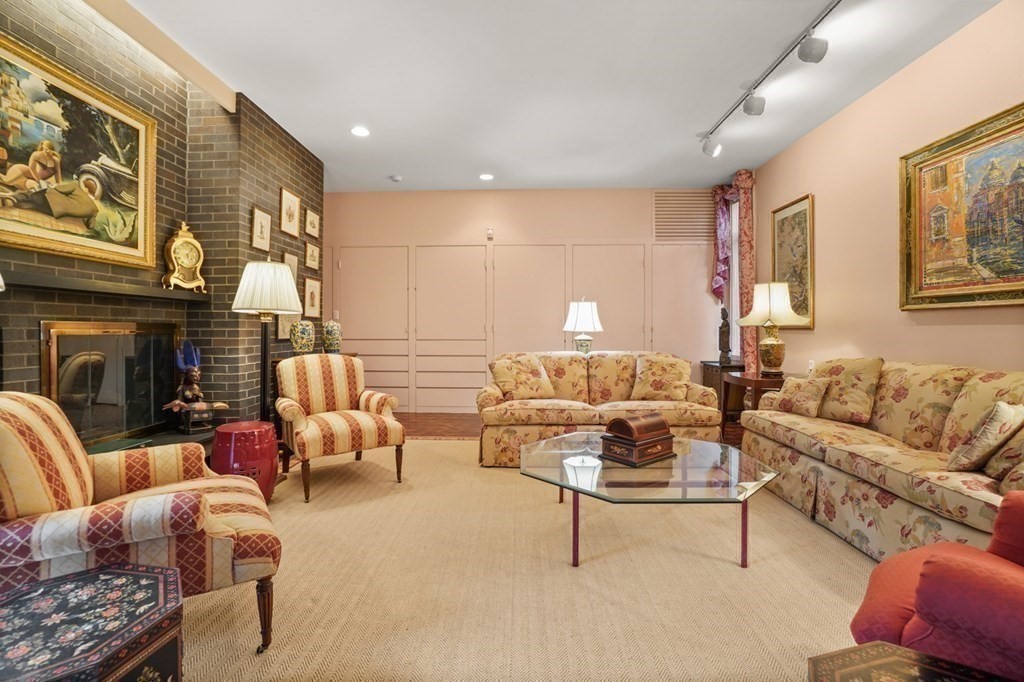 64 Highland Street Cambridge, MA 02138 - Photo 25 of 41 a living room with furniture and a fireplace