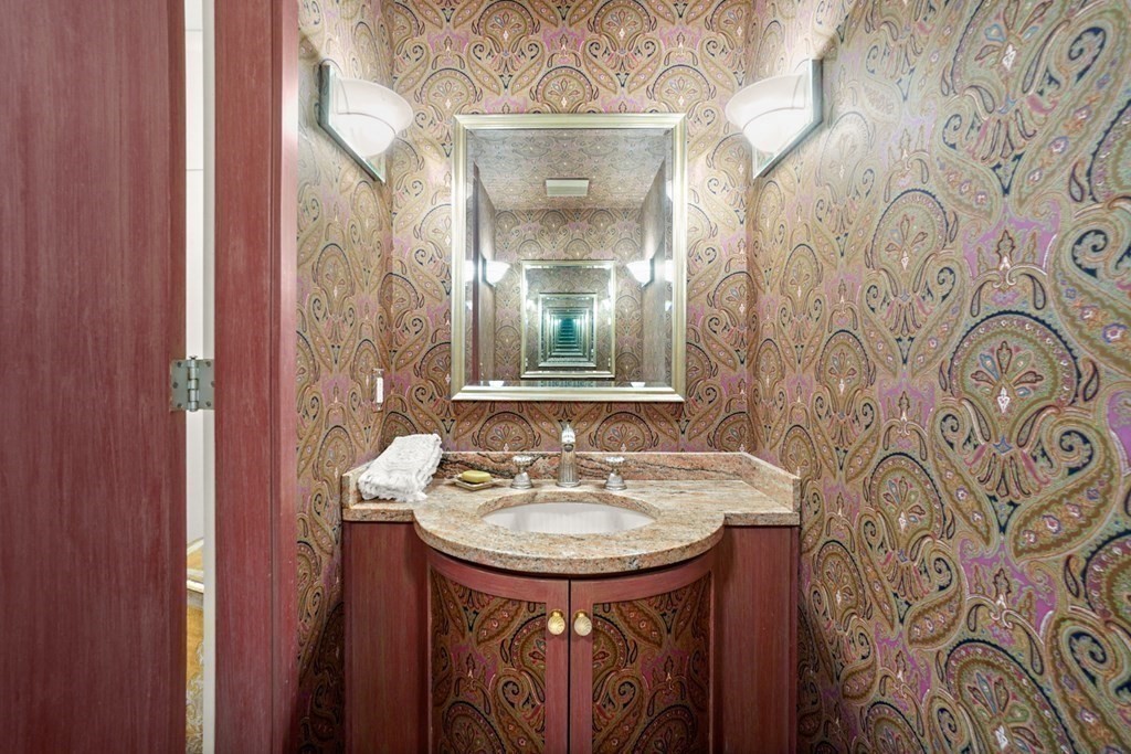 64 Highland Street Cambridge, MA 02138 - Photo 27 of 41 a bathroom with a sink and a mirror