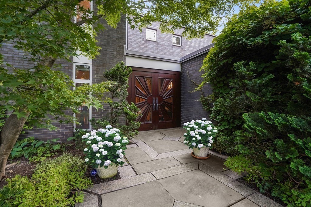 64 Highland Street Cambridge, MA 02138 - Photo 3 of 41 a house with a flower garden