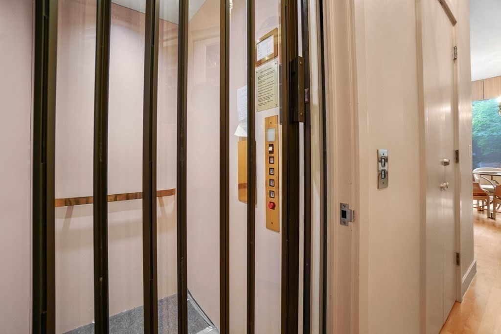 64 Highland Street Cambridge, MA 02138 - Photo 31 of 41 a view of a bathroom with sliding door