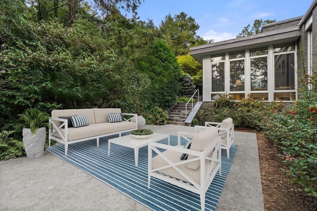 64 Highland Street Cambridge, MA 02138 - Photo 33 of 41 a view of a patio with couches table and chairs and potted plants