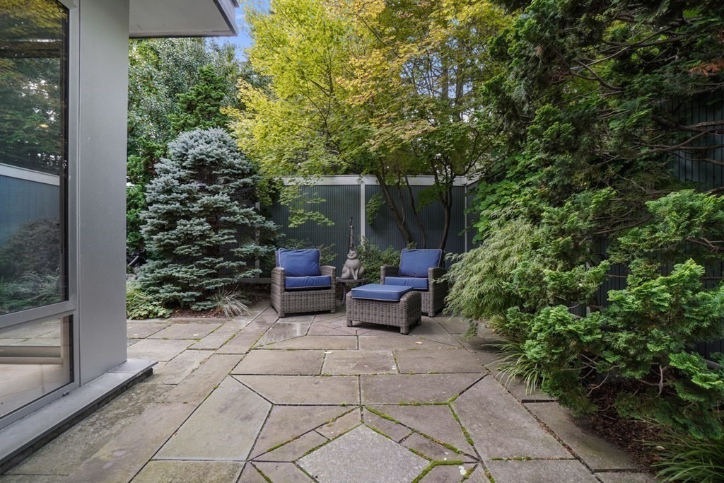 64 Highland Street Cambridge, MA 02138 - Photo 35 of 41 a view of backyard with outdoor seating and plants
