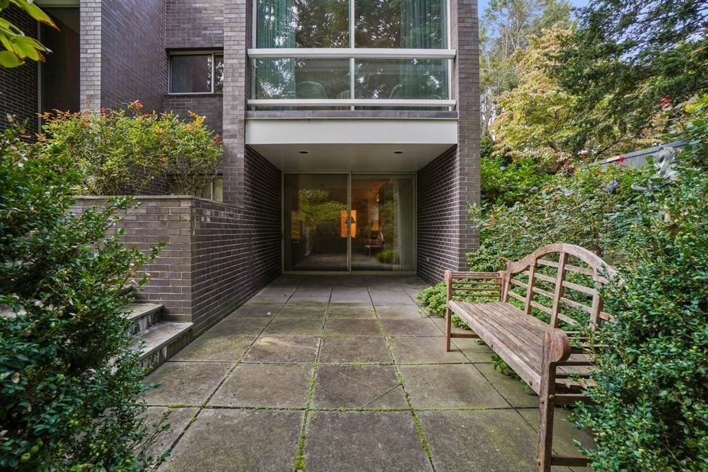 64 Highland Street Cambridge, MA 02138 - Photo 39 of 41 a view of a entryway door of the house with a yard