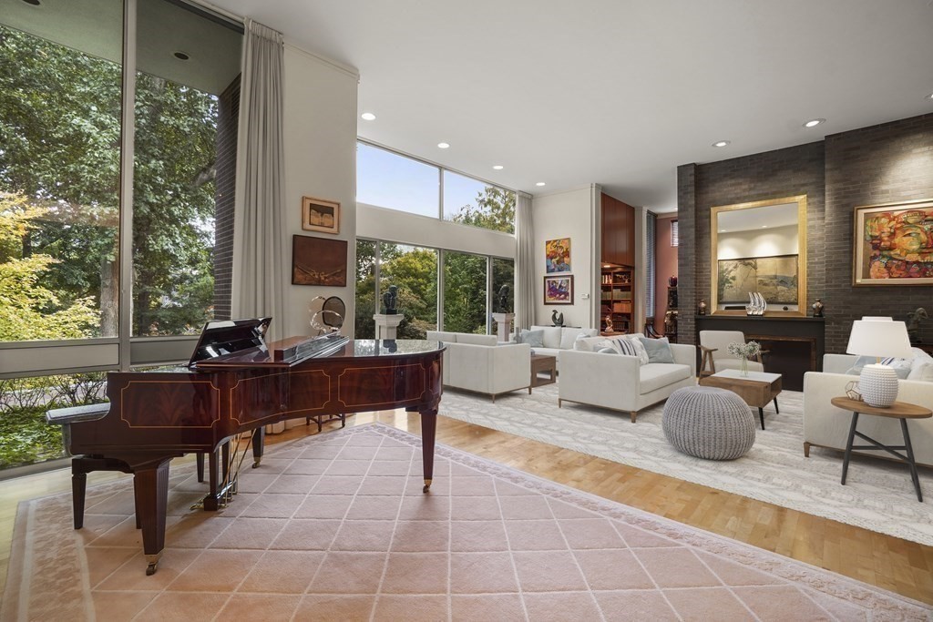 64 Highland Street Cambridge, MA 02138 - Photo 5 of 41 a living room with fireplace furniture and a large window