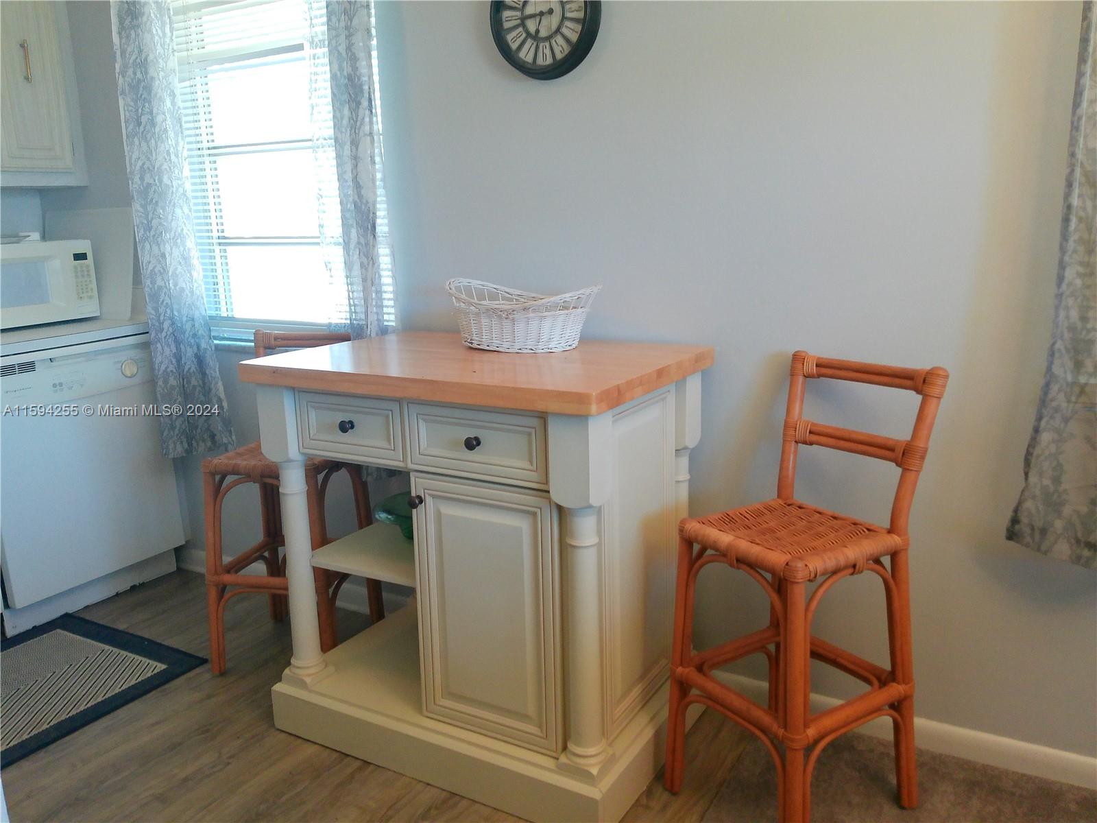 1100 East Indiantown Road, Unit 110 Jupiter, FL 33477 - Photo 8 of 19 a room with a table and chairs