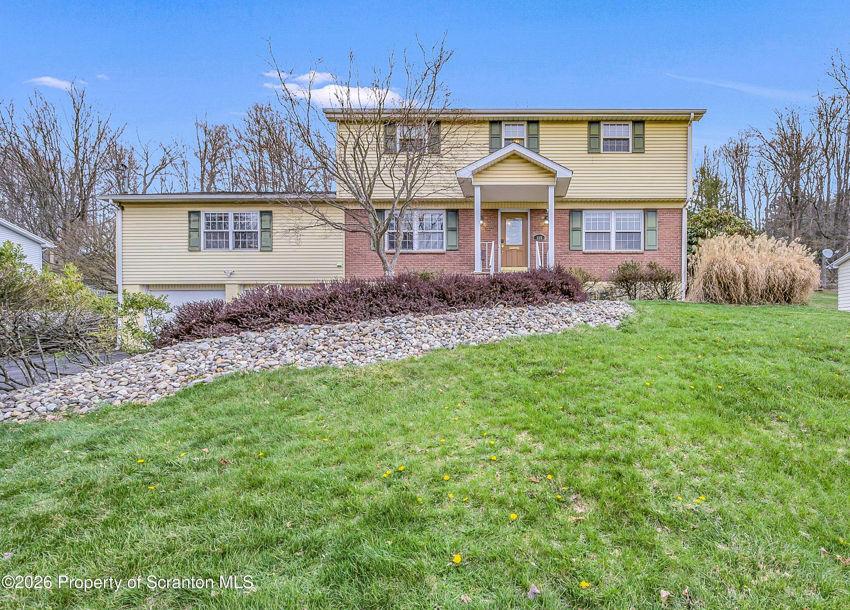 108 Sturbridge Road Clarks Summit, PA 18411 - Photo 2 of 67 a front view of a house with a garden