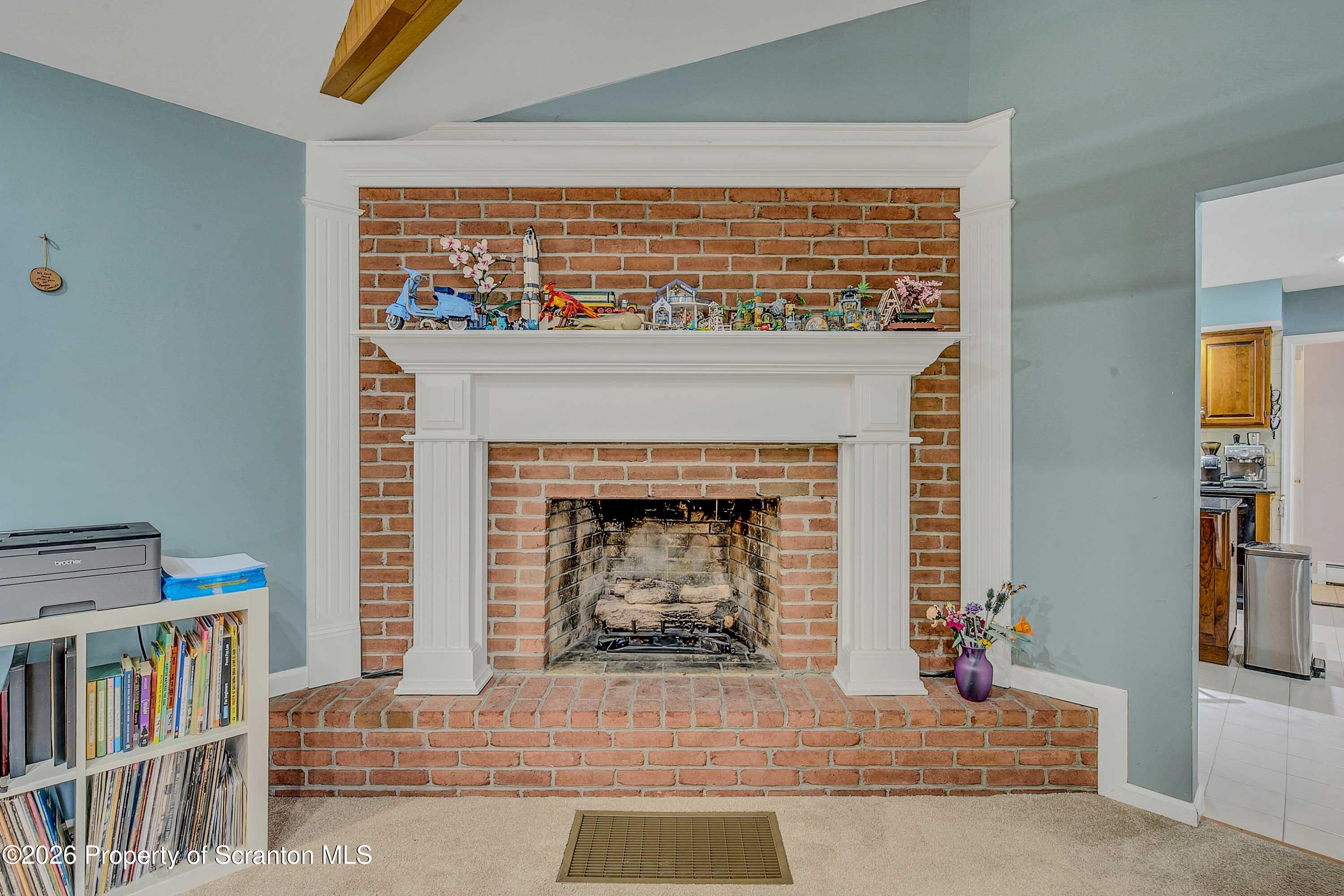 108 Sturbridge Road Clarks Summit, PA 18411 - Photo 22 of 67 a living room with a couch and a fireplace