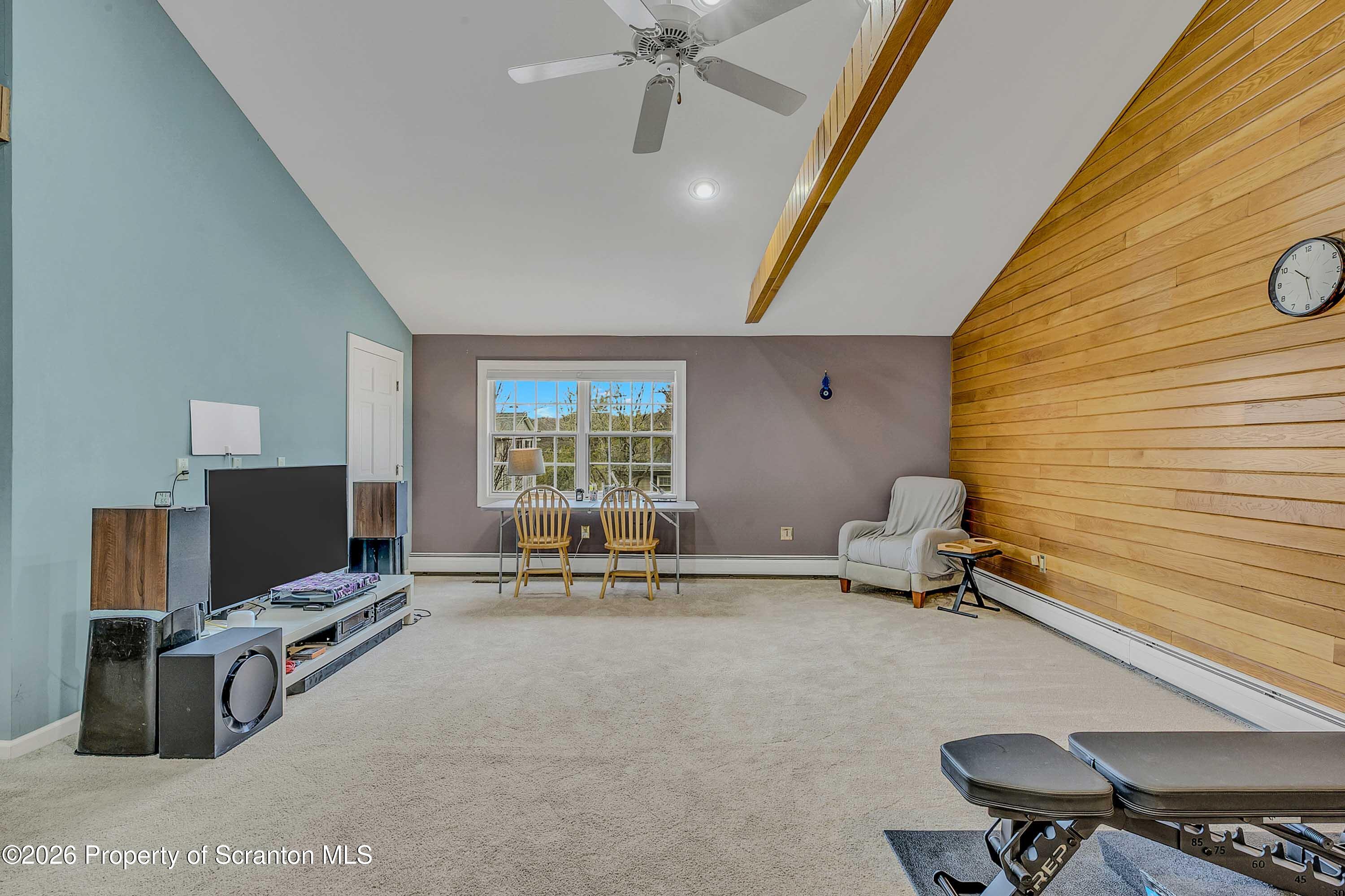 108 Sturbridge Road Clarks Summit, PA 18411 - Photo 23 of 67 a room with furniture and a flat screen tv