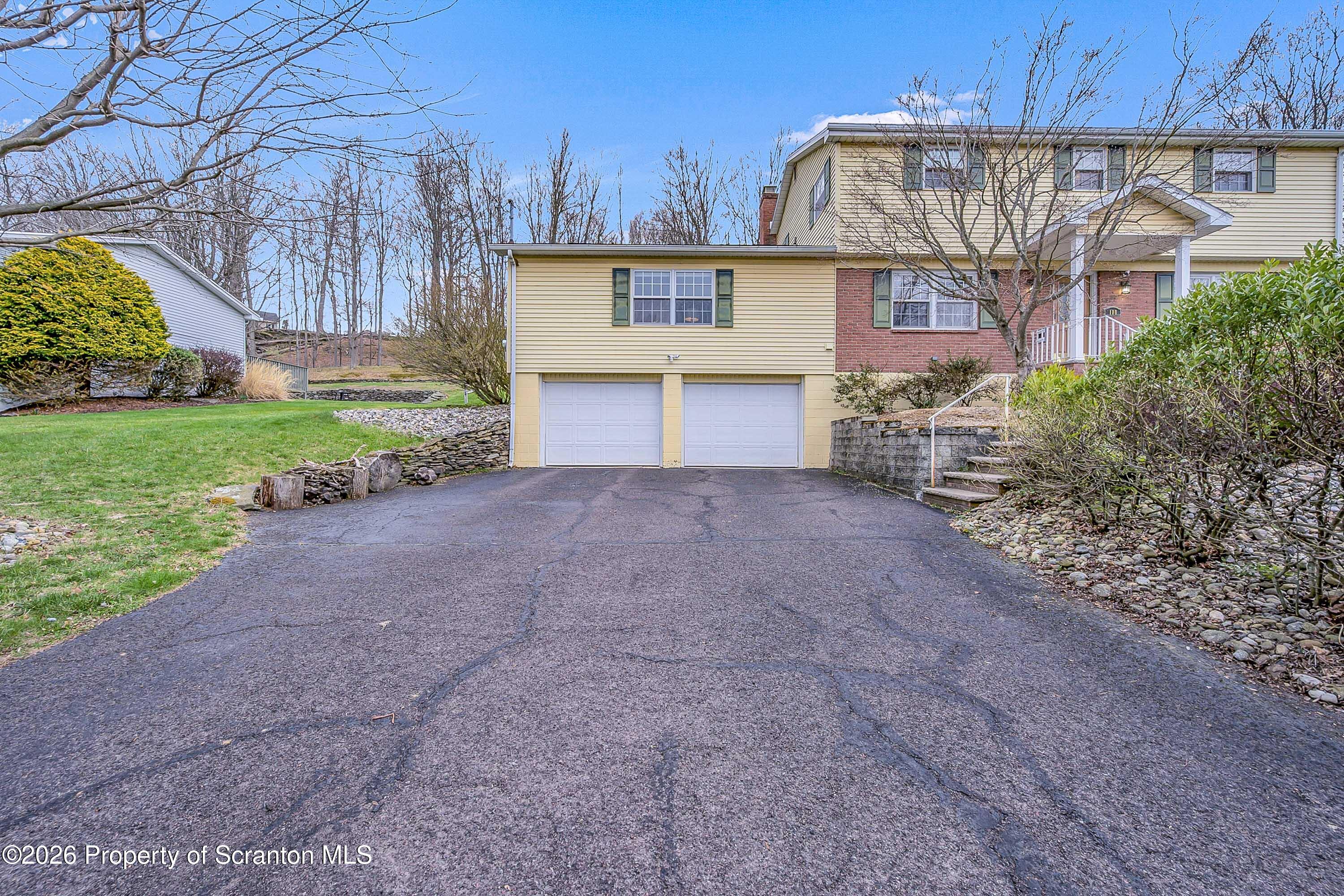 108 Sturbridge Road Clarks Summit, PA 18411 - Photo 3 of 67 a view of a house with a yard and potted plants