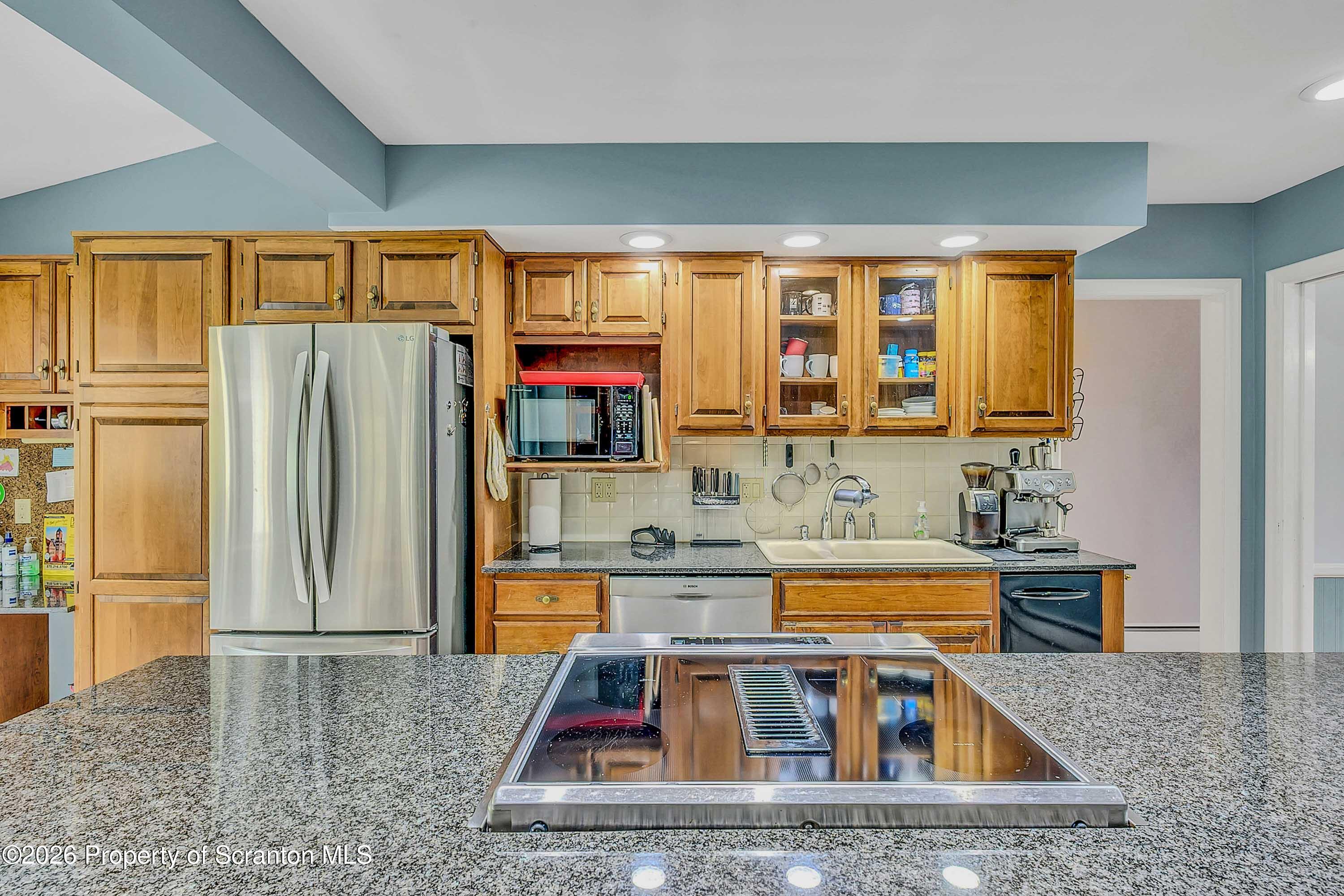 108 Sturbridge Road Clarks Summit, PA 18411 - Photo 36 of 67 a kitchen with stainless steel appliances granite countertop a refrigerator and a sink