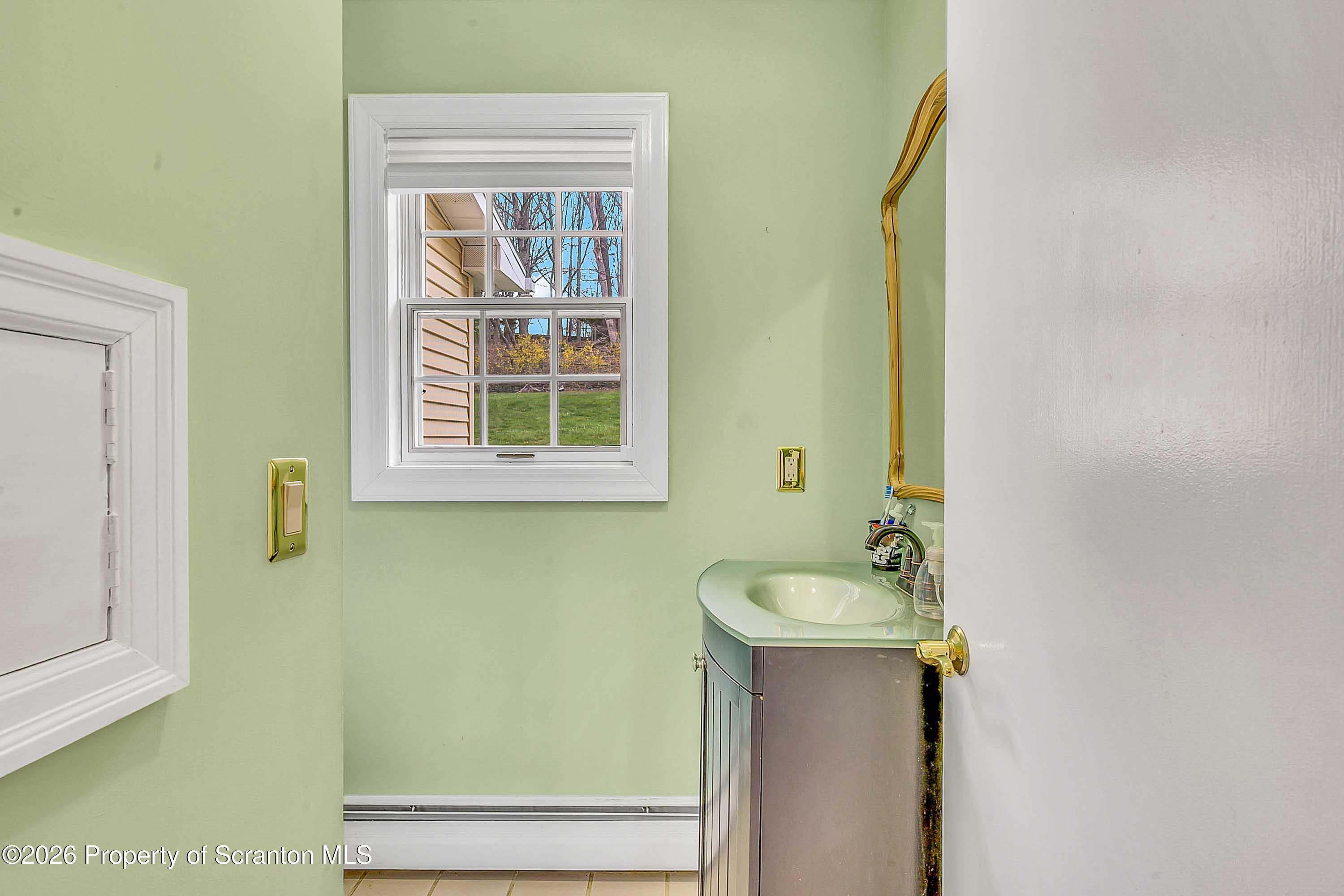 108 Sturbridge Road Clarks Summit, PA 18411 - Photo 39 of 67 a bathroom with a sink and a mirror