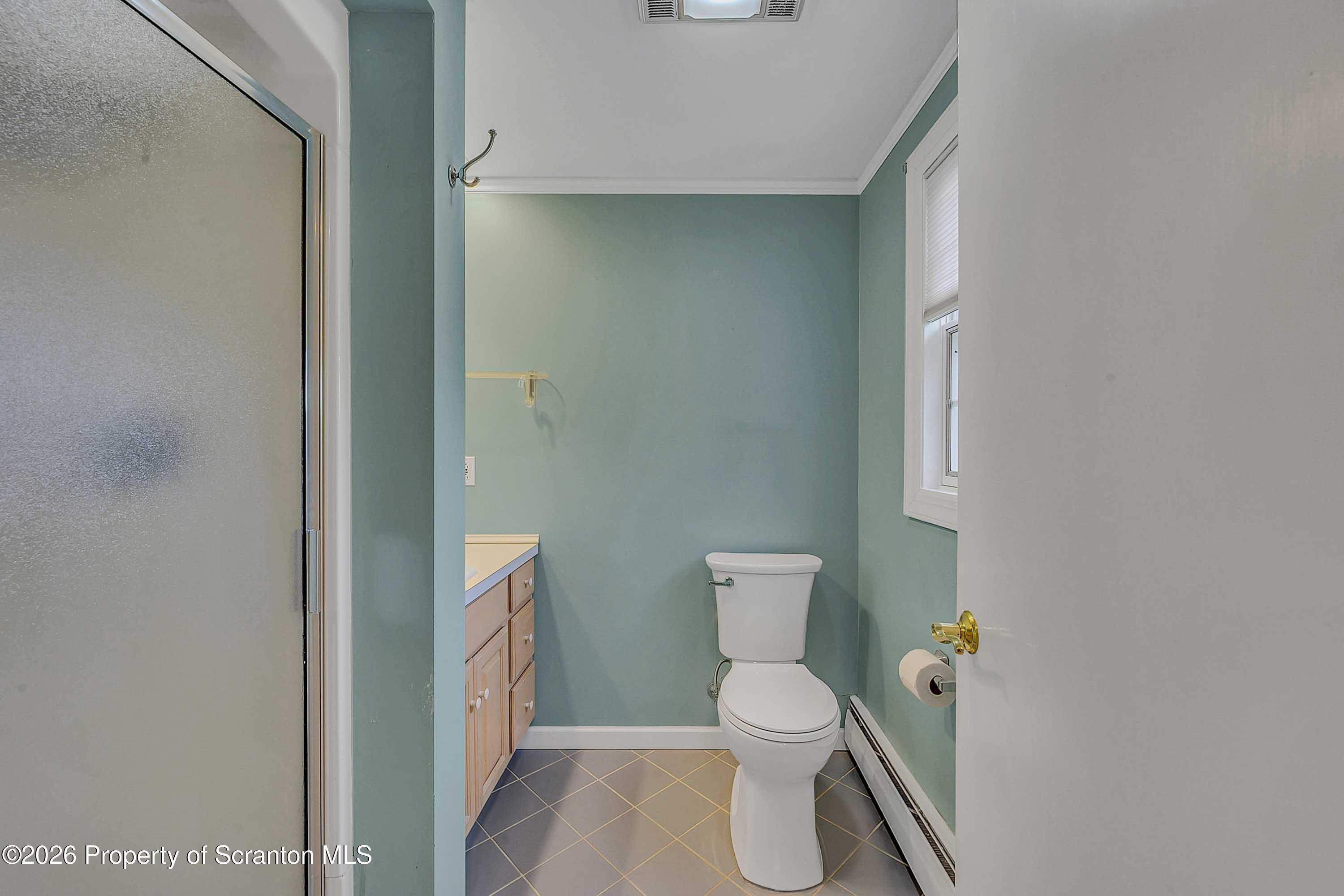 108 Sturbridge Road Clarks Summit, PA 18411 - Photo 44 of 67 a white toilet sitting next to a bathroom sink