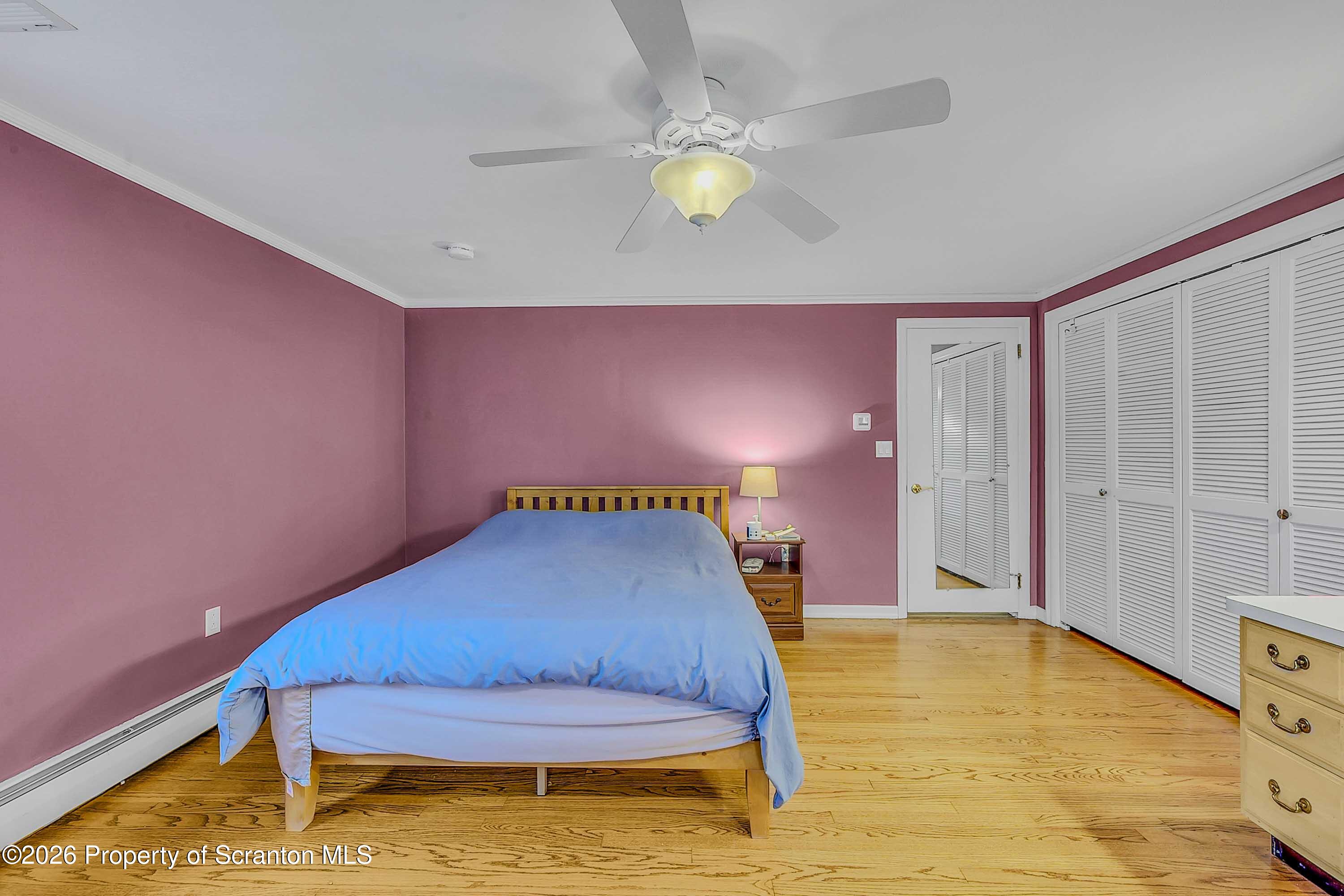 108 Sturbridge Road Clarks Summit, PA 18411 - Photo 46 of 67 a bedroom with a bed and a chandelier