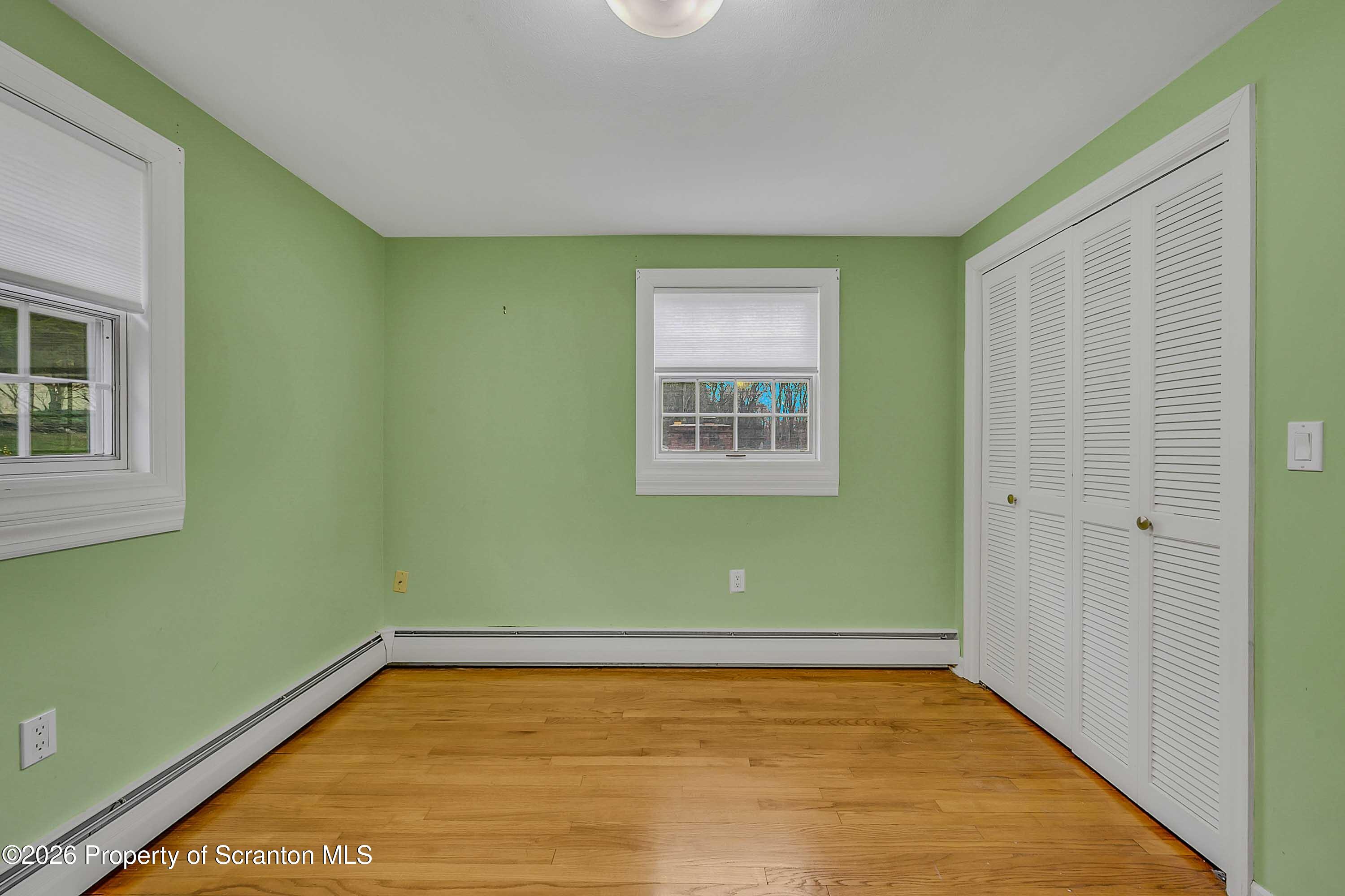 108 Sturbridge Road Clarks Summit, PA 18411 - Photo 51 of 67 a view of a room with wooden floor and windows