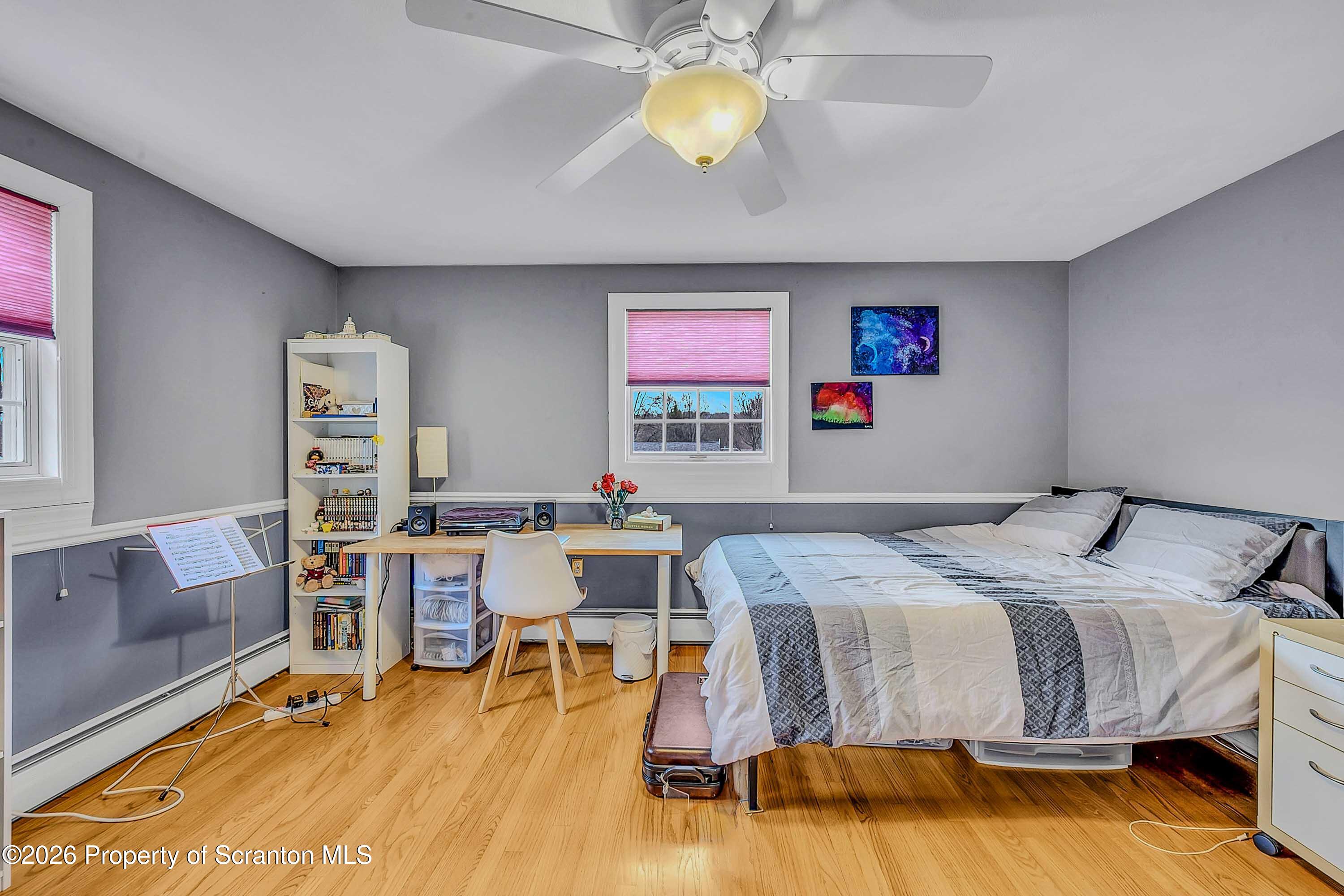 108 Sturbridge Road Clarks Summit, PA 18411 - Photo 55 of 67 a bedroom with a bed and a chandelier