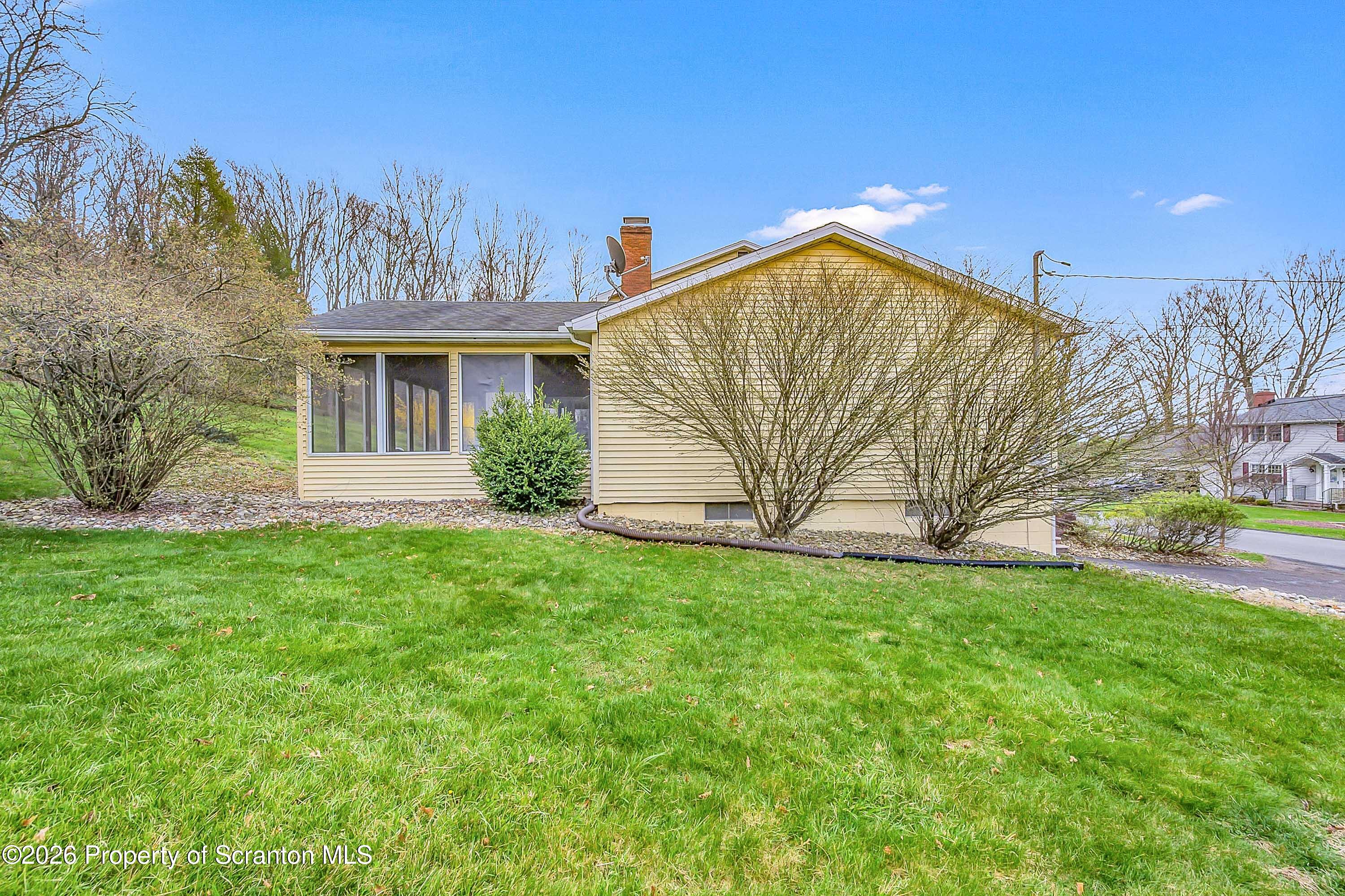 108 Sturbridge Road Clarks Summit, PA 18411 - Photo 61 of 67 a view of a house with backyard and a tree