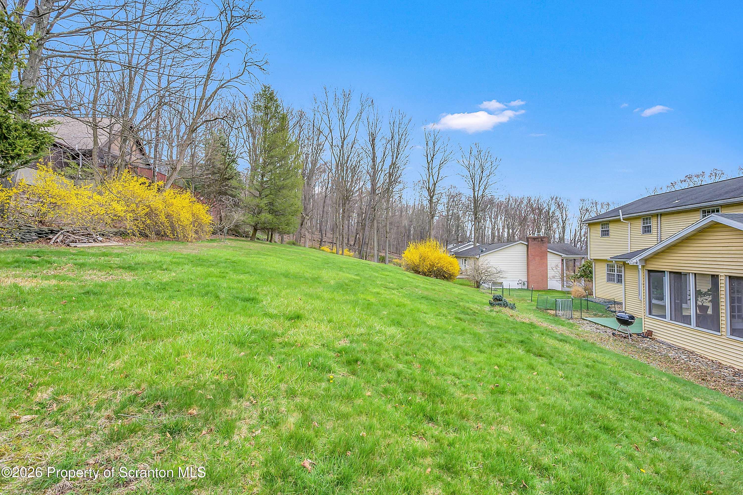 108 Sturbridge Road Clarks Summit, PA 18411 - Photo 7 of 67 a view of a house with a backyard