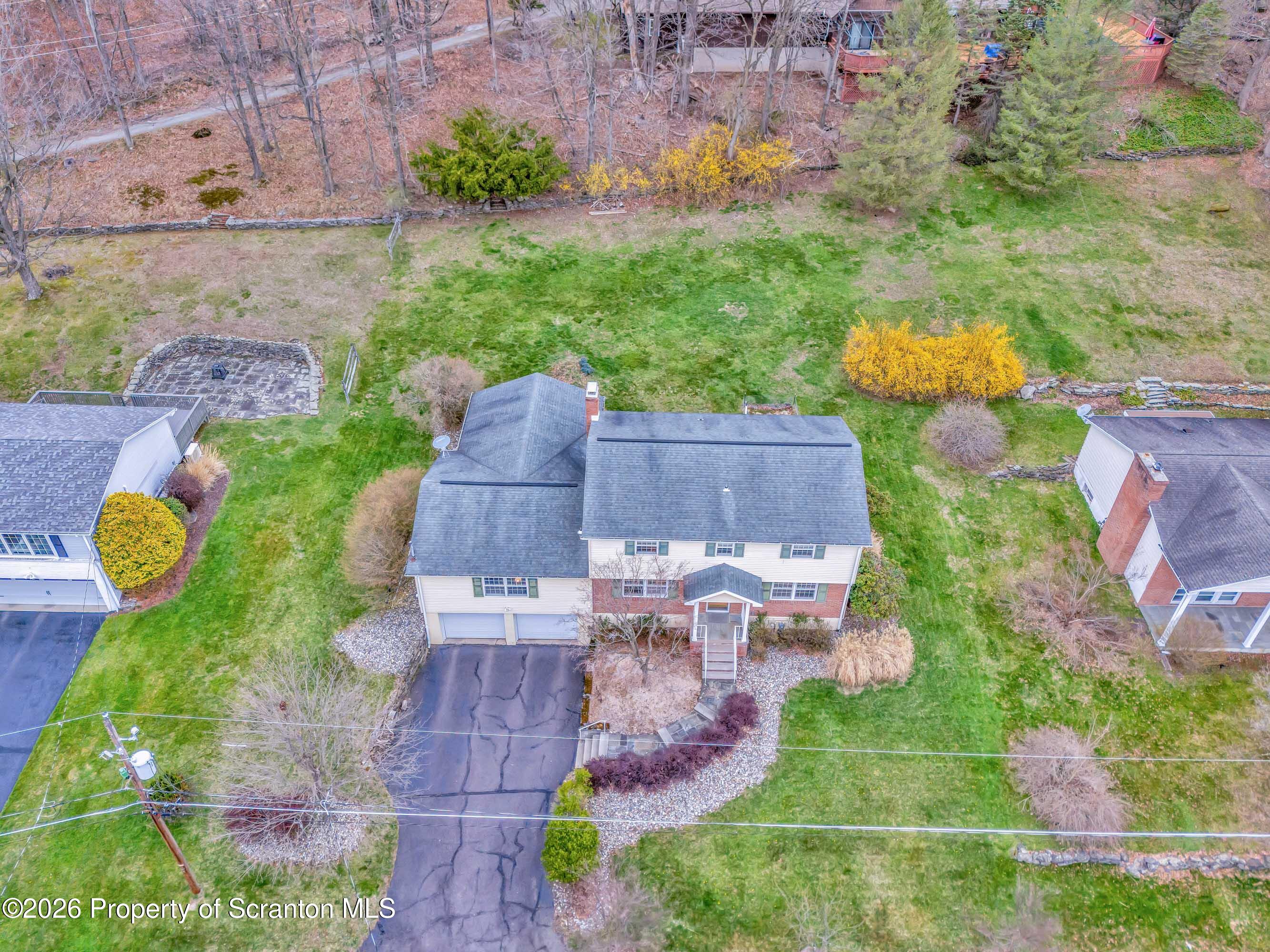 108 Sturbridge Road Clarks Summit, PA 18411 - Photo 8 of 67 an aerial view of a house with a yard and lake view