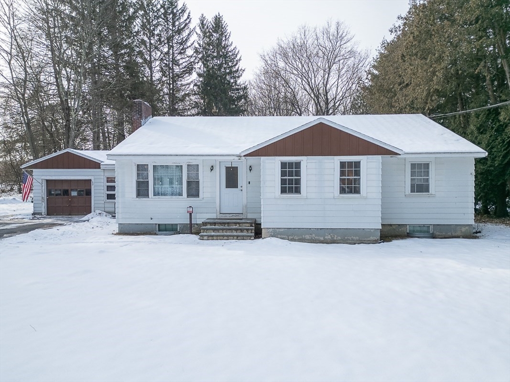 19 Mill Road Littleton, MA 01460 - Photo 1 of 31 a front view of a house with a yard and garage