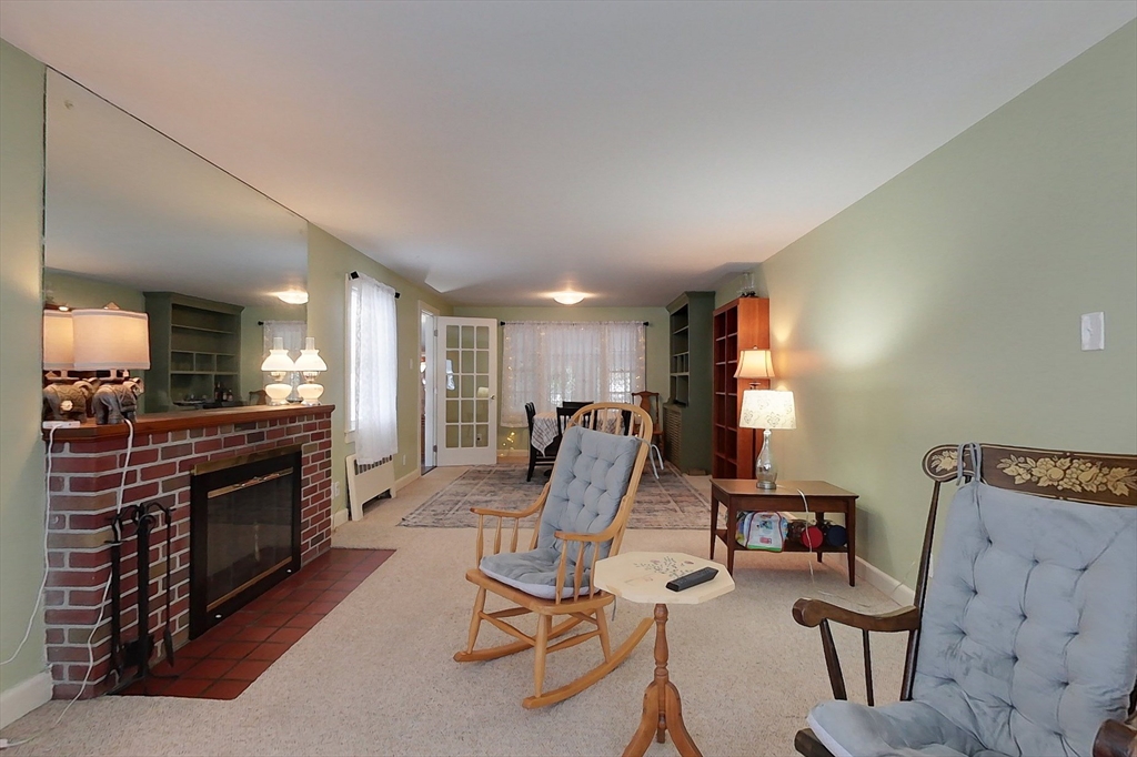 19 Mill Road Littleton, MA 01460 - Photo 13 of 31 a view of a livingroom with furniture and a fireplace