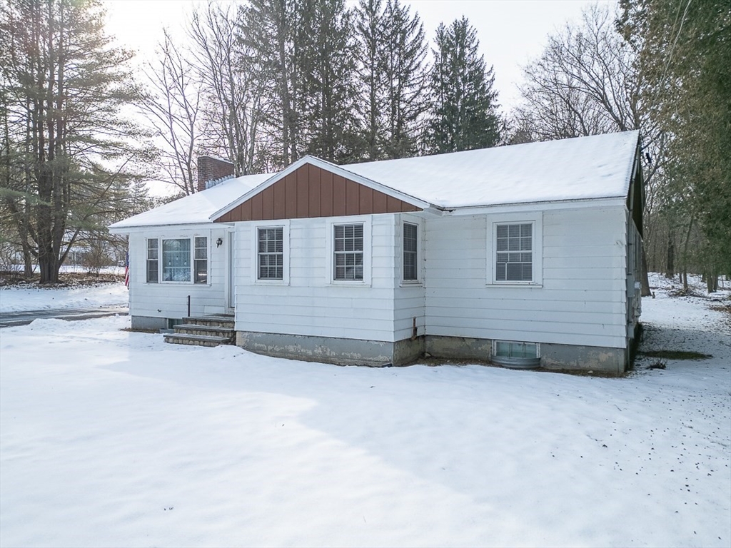 19 Mill Road Littleton, MA 01460 - Photo 25 of 31 a front view of a house with a yard