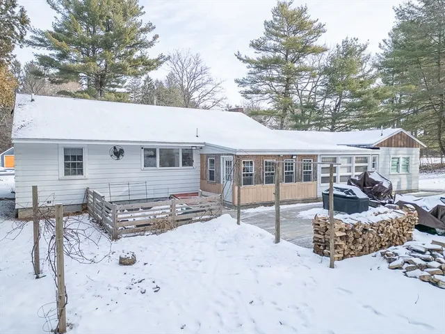 a view of a house with large windows