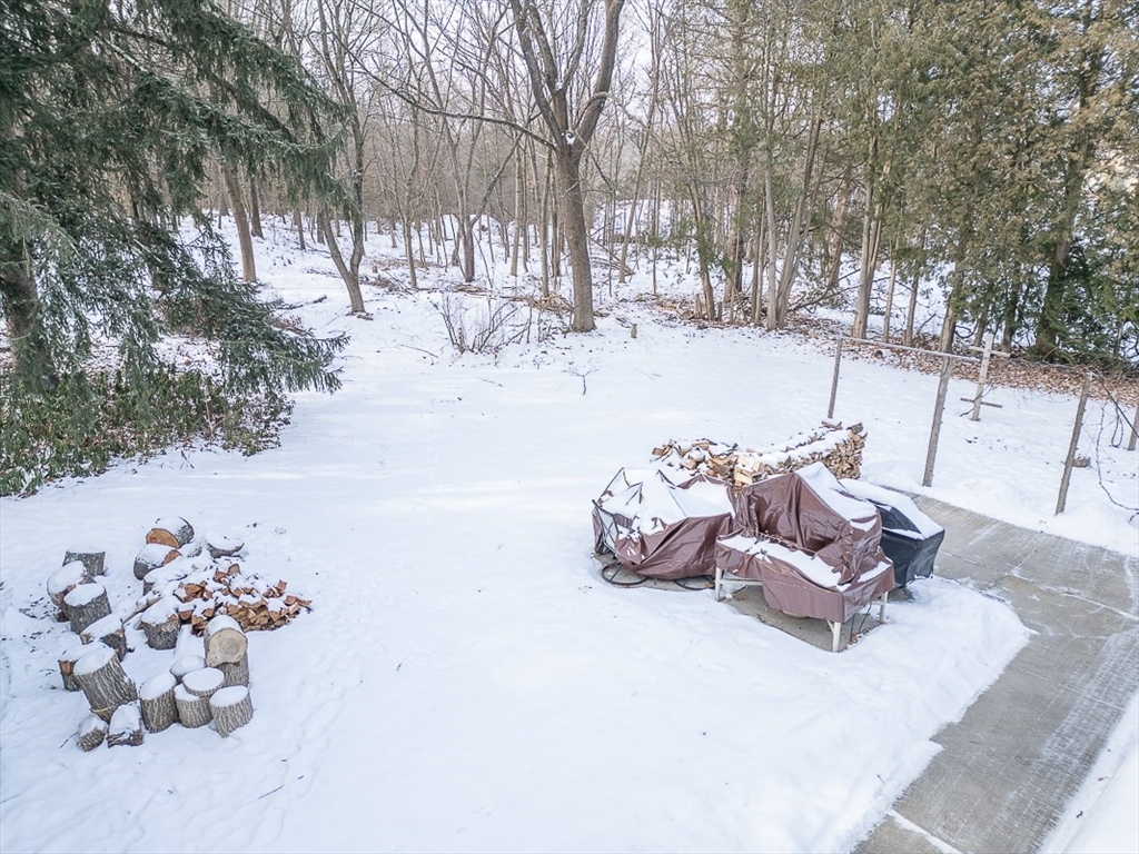 19 Mill Road Littleton, MA 01460 - Photo 27 of 31 a view of a yard with snow on the road