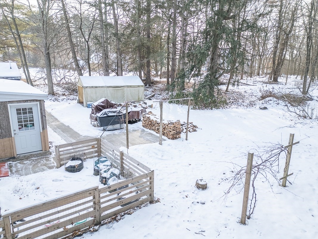 19 Mill Road Littleton, MA 01460 - Photo 28 of 31 a view of a backyard with a table and chairs