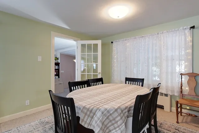 a bedroom with a bed and a table