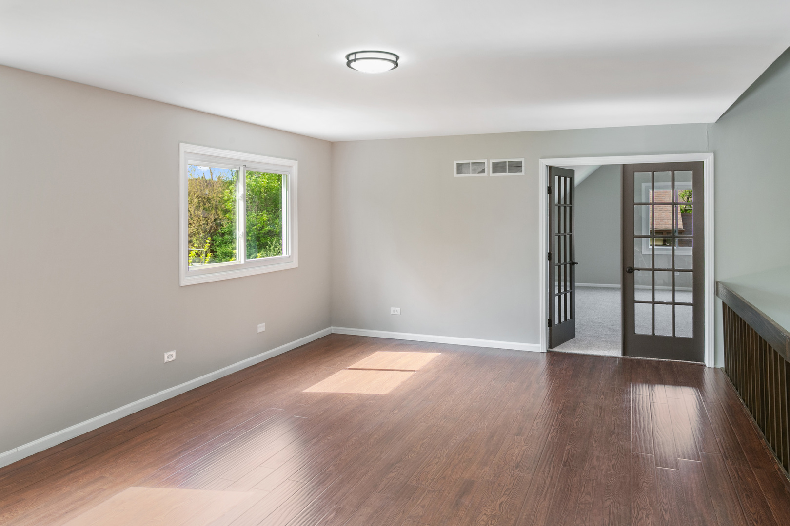 3618 Ronald Road Crete, IL 60417 - Photo 17 of 28 an empty room with wooden floor and windows