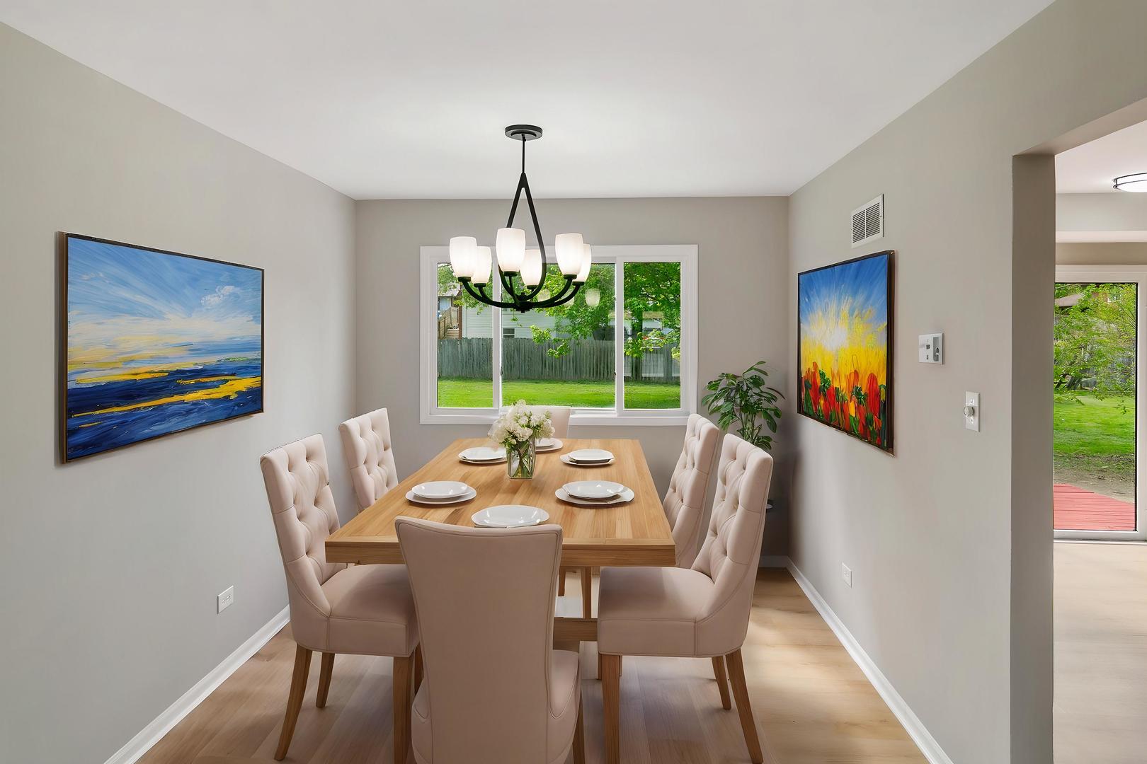 3618 Ronald Road Crete, IL 60417 - Photo 5 of 28 a dining room with furniture a chandelier and wooden floor