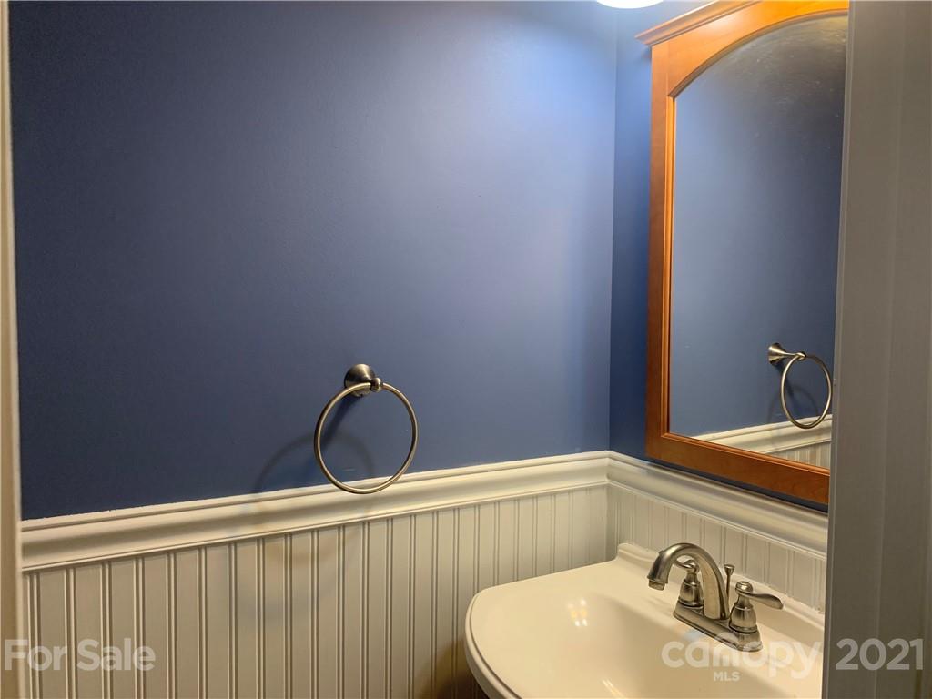 136 Royalton Road Mooresville, NC 28115 - Photo 11 of 28 a bathroom with a sink and a mirror