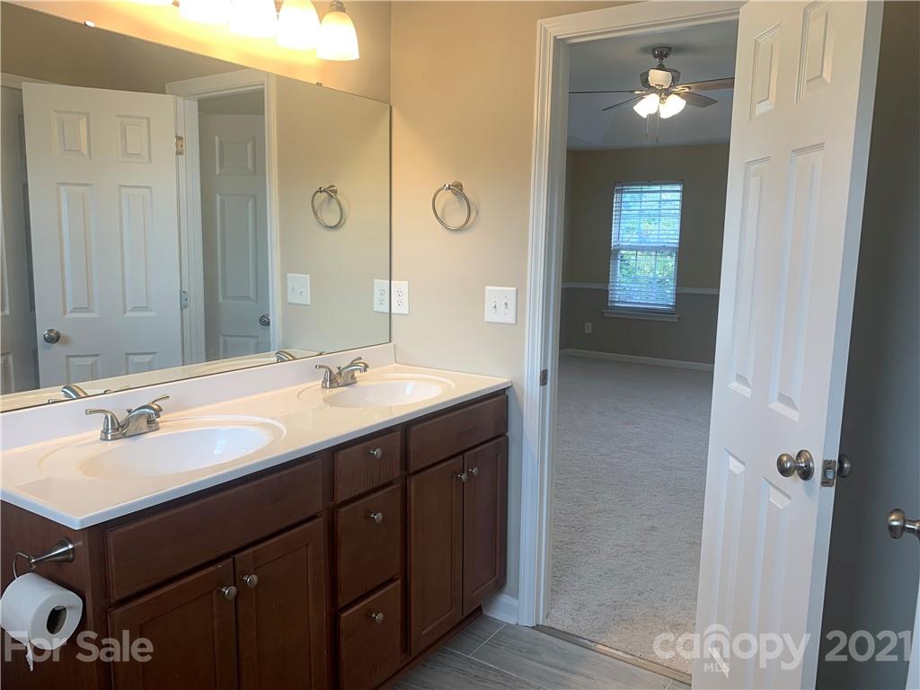 136 Royalton Road Mooresville, NC 28115 - Photo 15 of 28 a bathroom with a sink double vanity and a mirror
