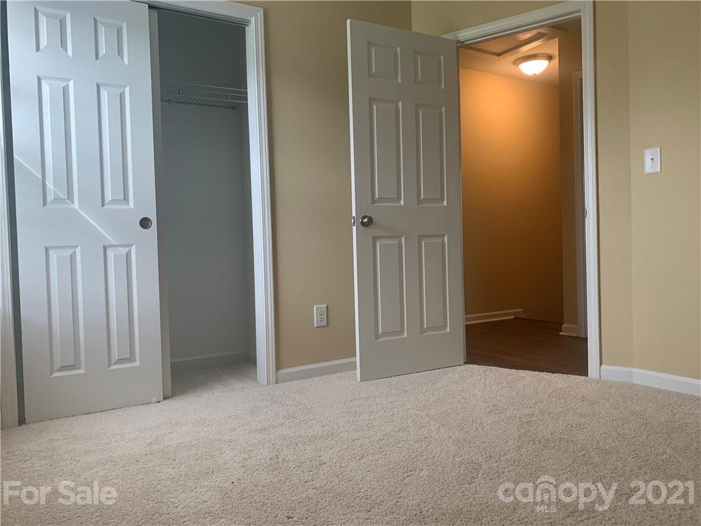 136 Royalton Road Mooresville, NC 28115 - Photo 20 of 28 a view of an empty room with closet and mirror