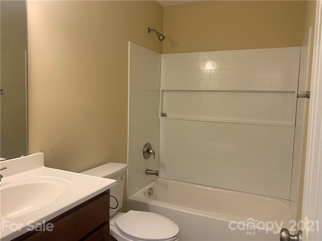 136 Royalton Road Mooresville, NC 28115 - Photo 24 of 28 a bathroom with a sink toilet and shower