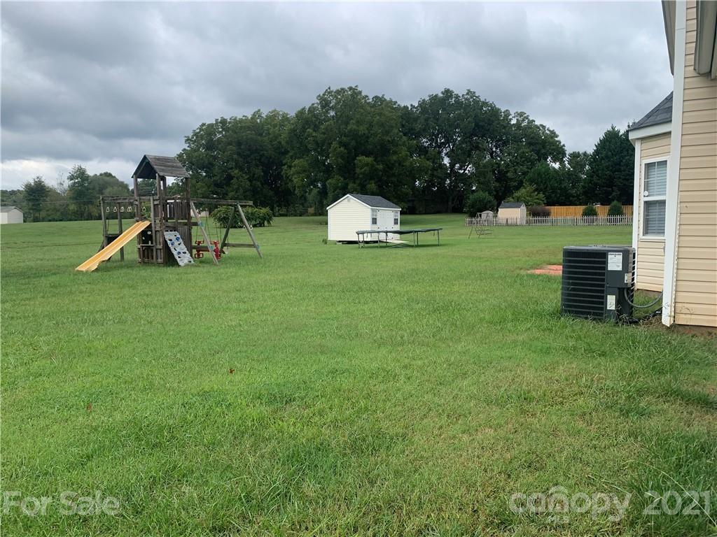136 Royalton Road Mooresville, NC 28115 - Photo 26 of 28 a view of a garden with plants and a lake view