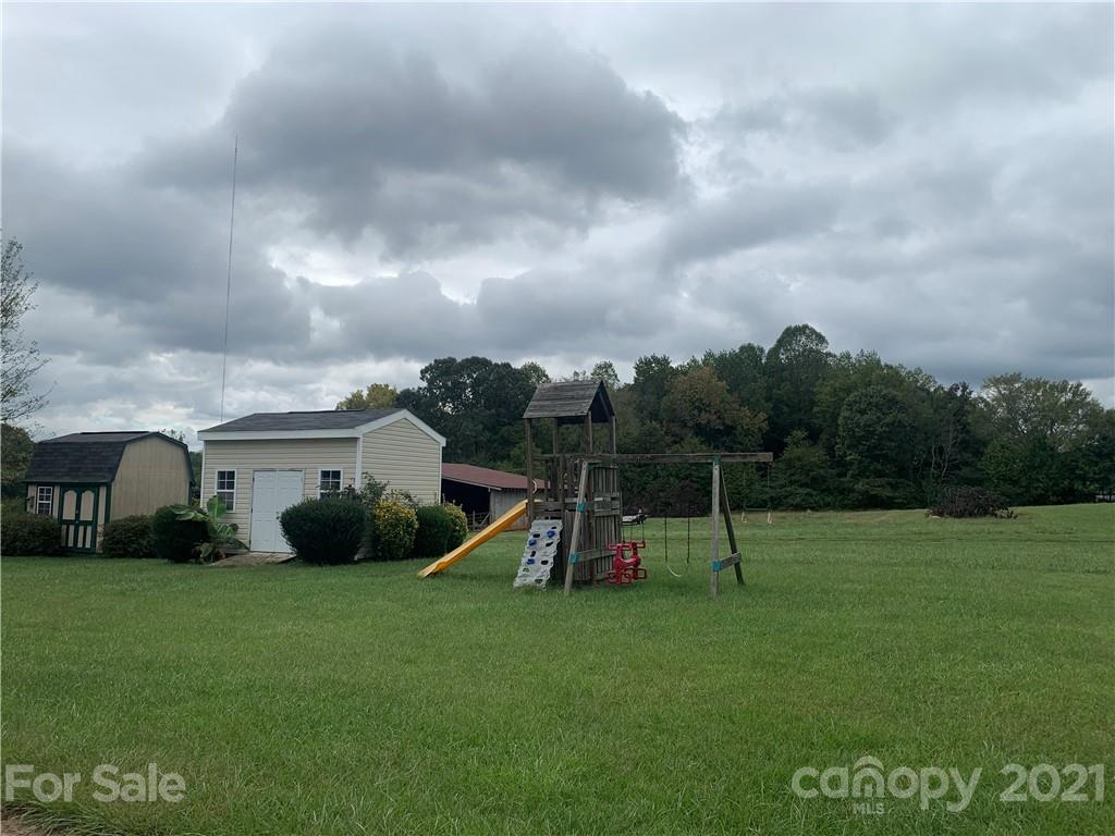136 Royalton Road Mooresville, NC 28115 - Photo 27 of 28 a view of a house with a backyard and a garden