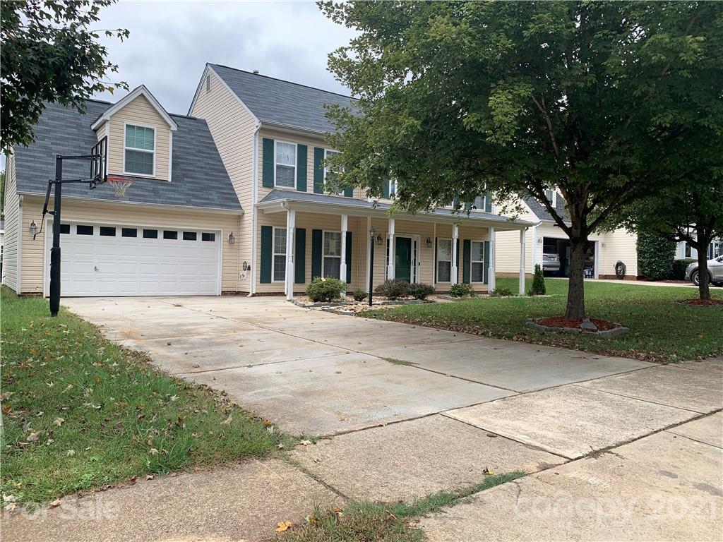 136 Royalton Road Mooresville, NC 28115 - Photo 28 of 28 a front view of a house with a garden