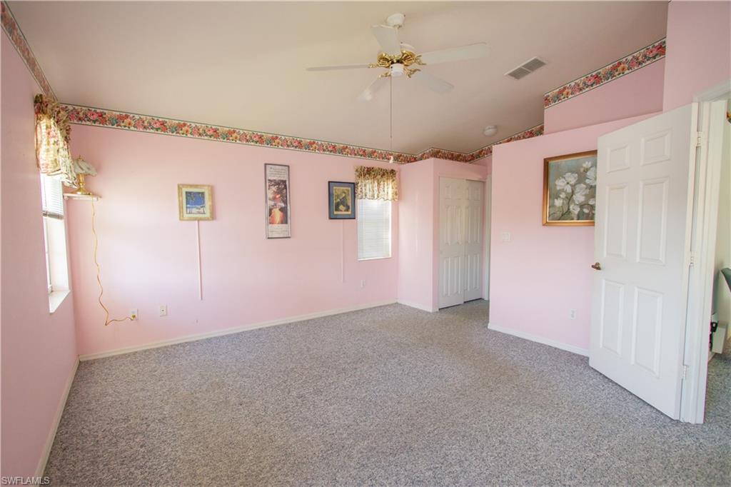 7648 Oleander Gate Drive, Unit 202 Naples, FL 34109 - Photo 14 of 23 a view of a big room with closet and windows