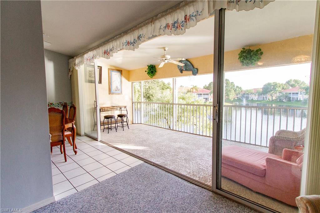 7648 Oleander Gate Drive, Unit 202 Naples, FL 34109 - Photo 6 of 23 a living room filled with furniture