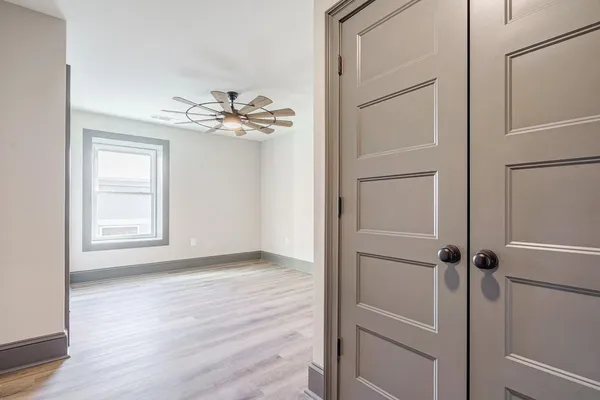 a view of an empty room with a window