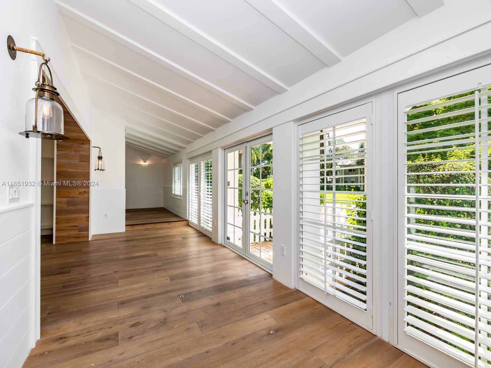 4700 Lake Road Miami, FL 33137 - Photo 13 of 92 a view of empty room with wooden floor and fan
