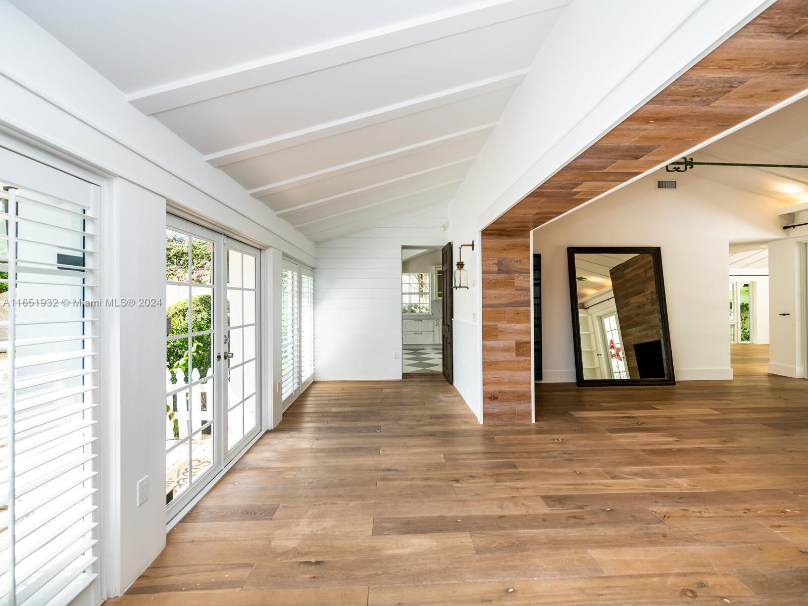 4700 Lake Road Miami, FL 33137 - Photo 14 of 92 a view of empty room with wooden floor and fan