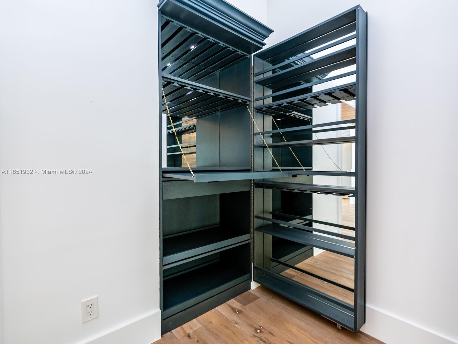 4700 Lake Road Miami, FL 33137 - Photo 19 of 92 a view of room with racks on the wall