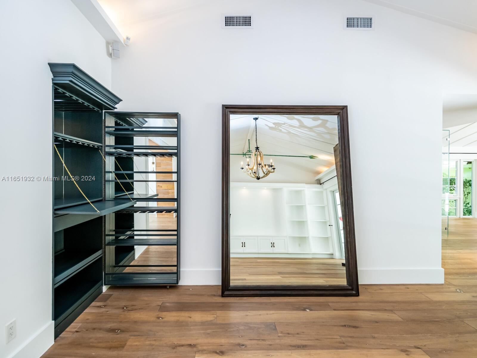 4700 Lake Road Miami, FL 33137 - Photo 20 of 92 a view of walk in closet with empty racks