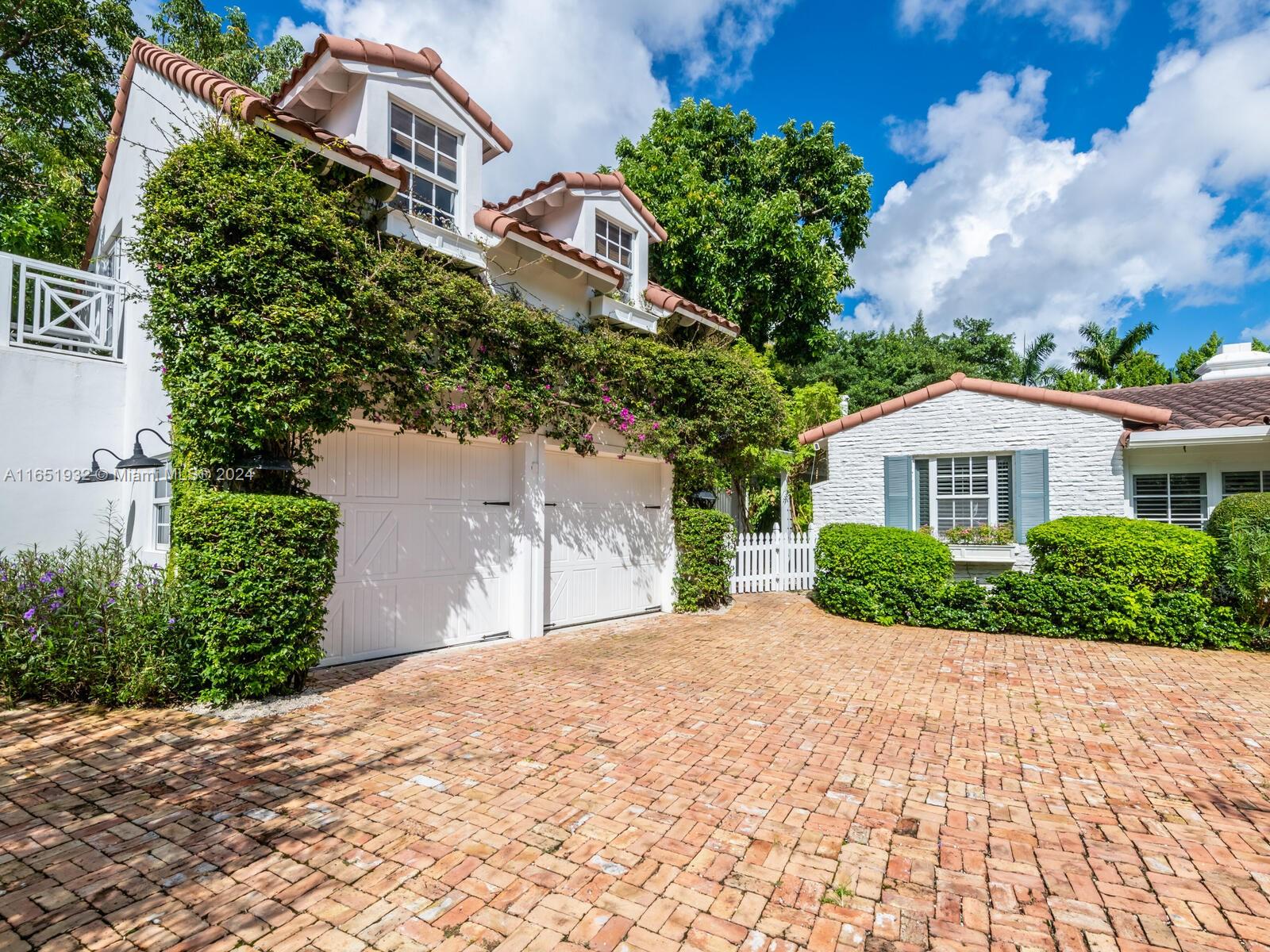 4700 Lake Road Miami, FL 33137 - Photo 2 of 92 a front view of a house with a yard