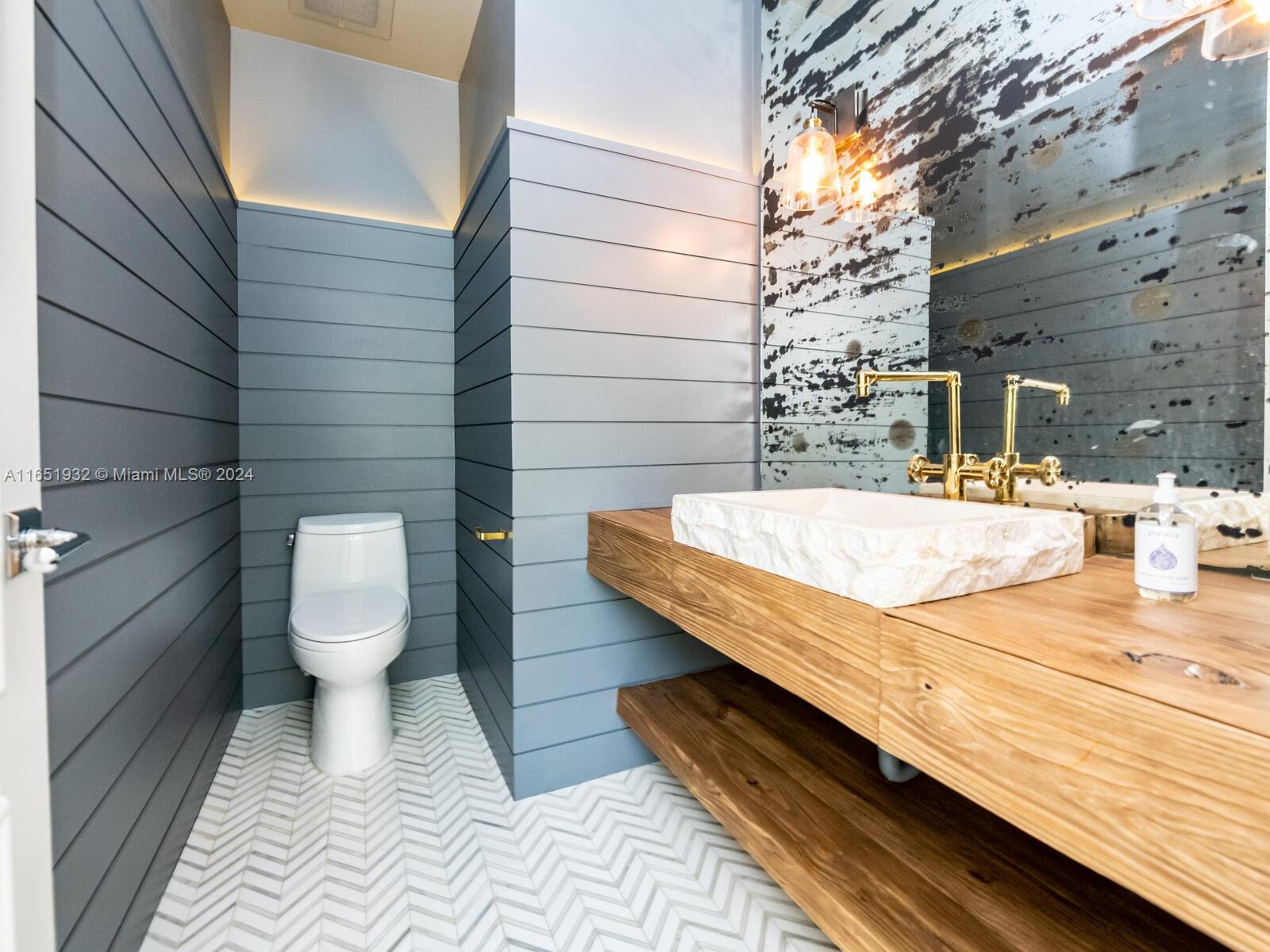 4700 Lake Road Miami, FL 33137 - Photo 25 of 92 a bathroom with a sink and a toilet